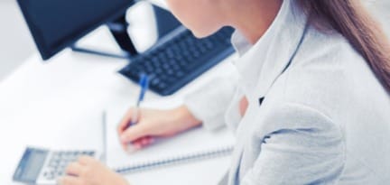 businesswoman with notebook and calculator PSJT9A4 768x1152 1