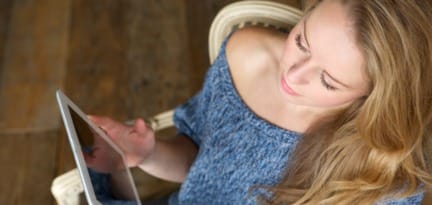 woman learning how to use touchscreen tablet P2WJCA7