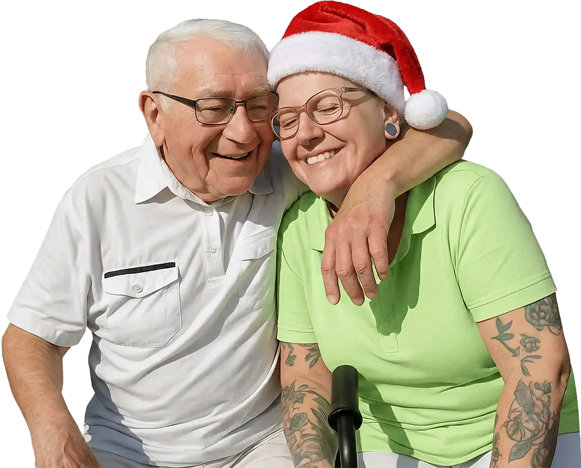 Weitergebildete Pflegekraft mit Weihnachtshut und ihr Patient freuen sich liebevoll